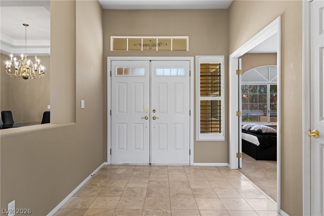 649 Rancho Circle Mesquite, NV 89027 - Photo 3 of 73 Enter this inviting space featuring durable tile flooring, setting a welcoming tone for the home.