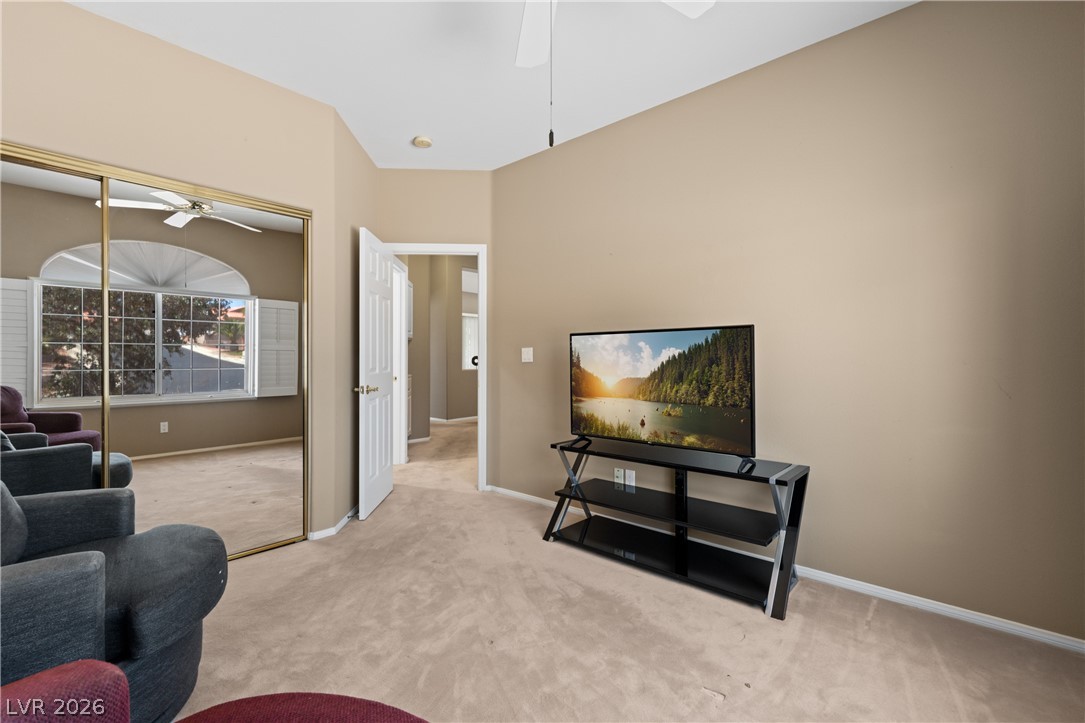 649 Rancho Circle Mesquite, NV 89027 - Photo 33 of 73 This cozy bedroom features carpeted flooring and ample natural light from an arched window.