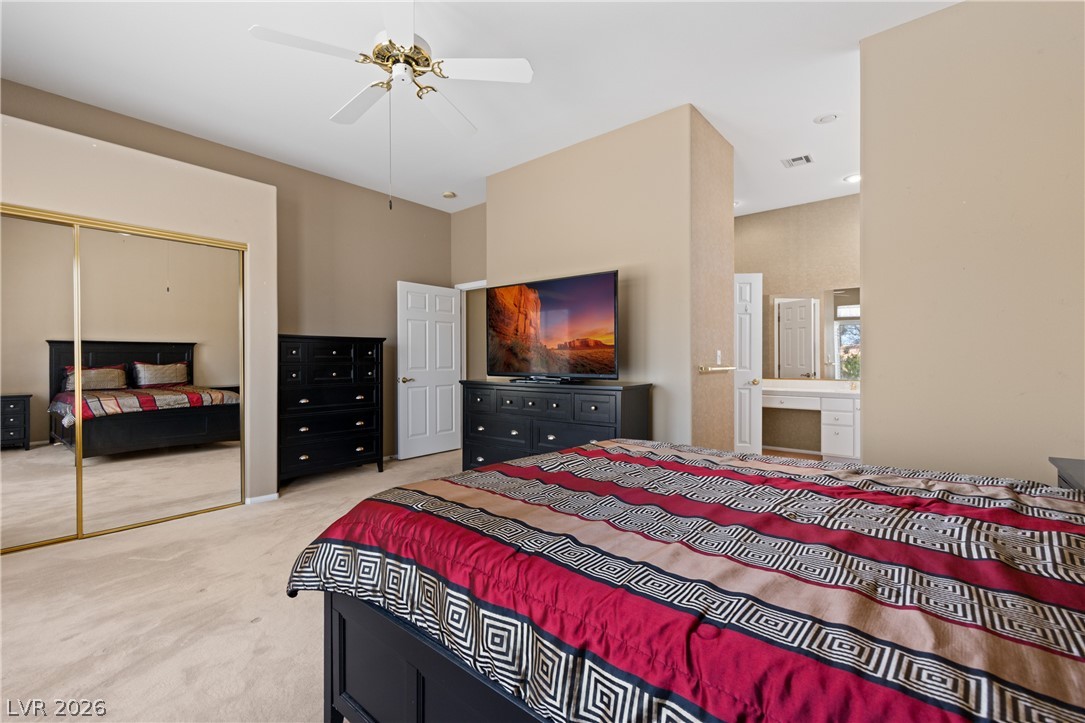 649 Rancho Circle Mesquite, NV 89027 - Photo 36 of 73 This spacious bedroom offers ample comfort and direct access to a well-appointed bathroom.