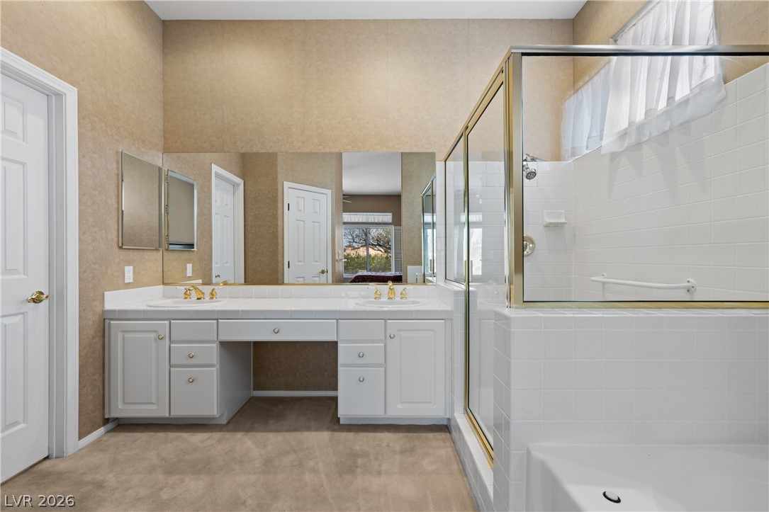 649 Rancho Circle Mesquite, NV 89027 - Photo 37 of 73 This primary bathroom features a dual vanity and a spacious shower.