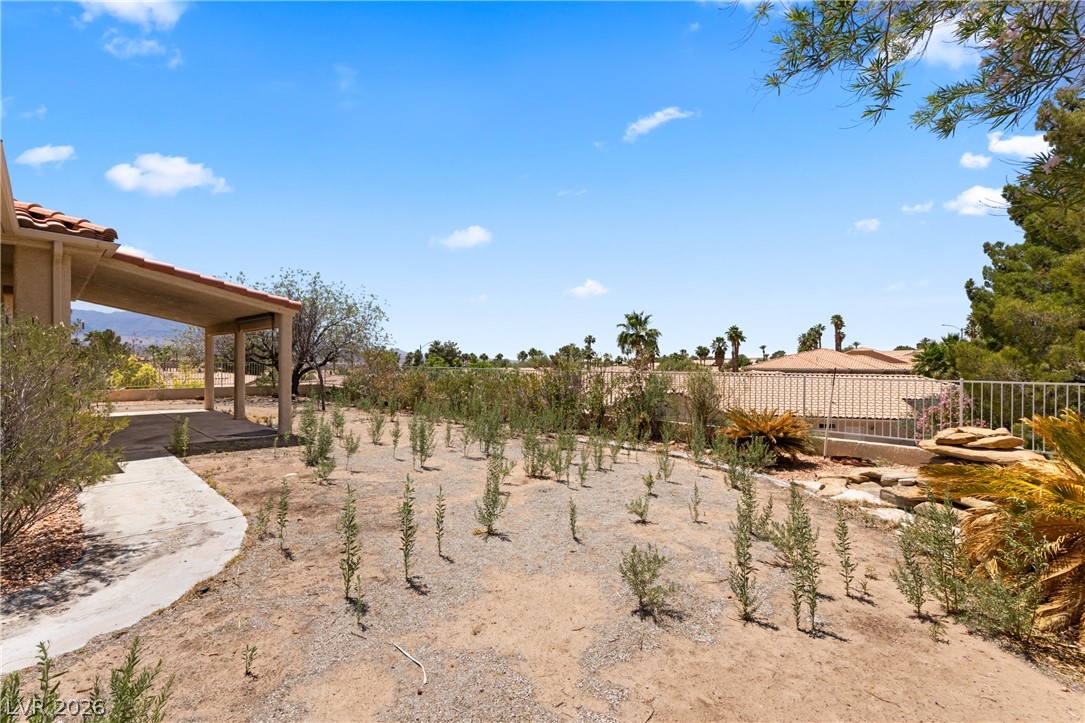 649 Rancho Circle Mesquite, NV 89027 - Photo 48 of 73 This spacious yard offers ample room for outdoor activities, complemented by a covered patio for relaxation.