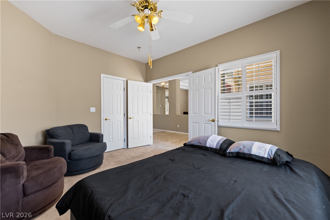 649 Rancho Circle Mesquite, NV 89027 - Photo 5 of 73 This spacious bedroom offers ample comfort and natural light.