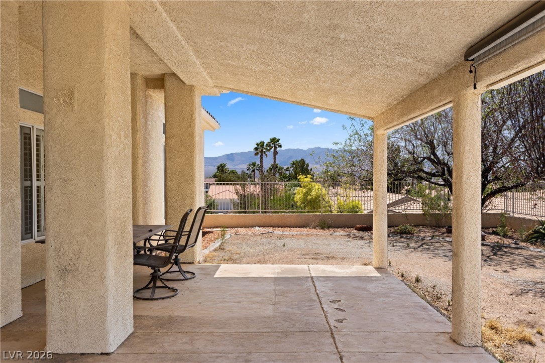 649 Rancho Circle Mesquite, NV 89027 - Photo 53 of 73 This covered patio offers serene mountain views, perfect for peaceful outdoor living.