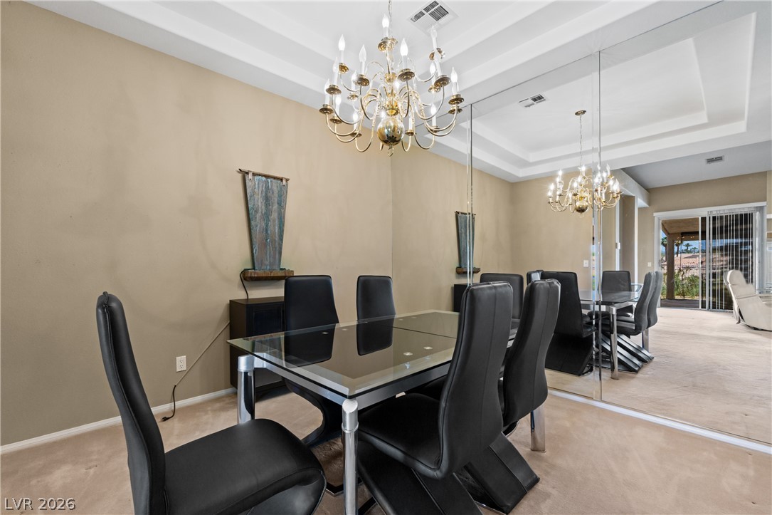 649 Rancho Circle Mesquite, NV 89027 - Photo 6 of 73 This elegant dining space features a sophisticated chandelier and expansive mirror wall.