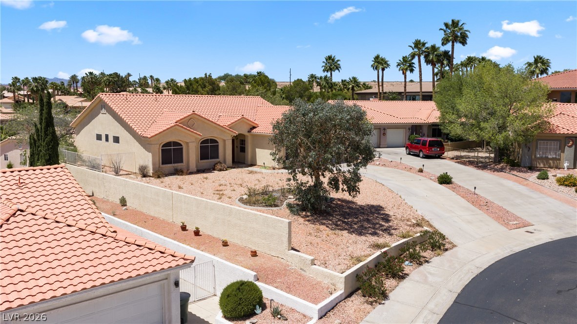 649 Rancho Circle Mesquite, NV 89027 - Photo 66 of 73 This desert oasis features a classic tiled roof and expansive driveway, offering ample parking.