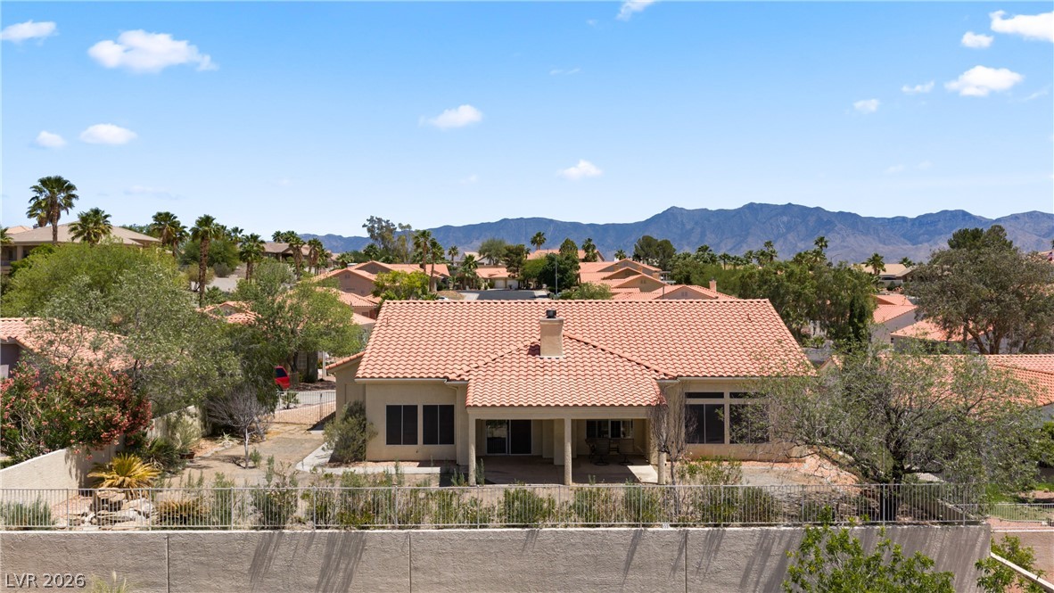 649 Rancho Circle Mesquite, NV 89027 - Photo 69 of 73 This desert oasis features a serene back of structure view with a vibrant natural landscape and mountain vistas.