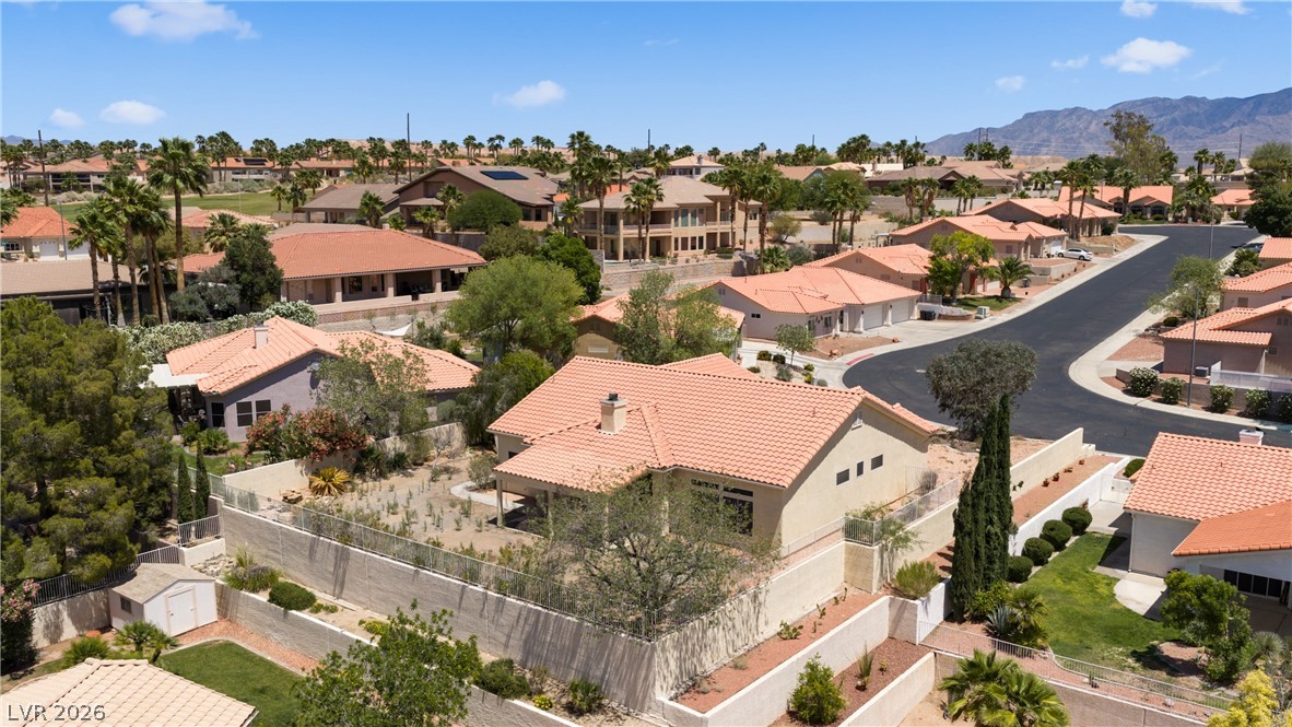 649 Rancho Circle Mesquite, NV 89027 - Photo 70 of 73 An aerial perspective reveals a vibrant neighborhood under a clear sky, surrounded by natural beauty.
