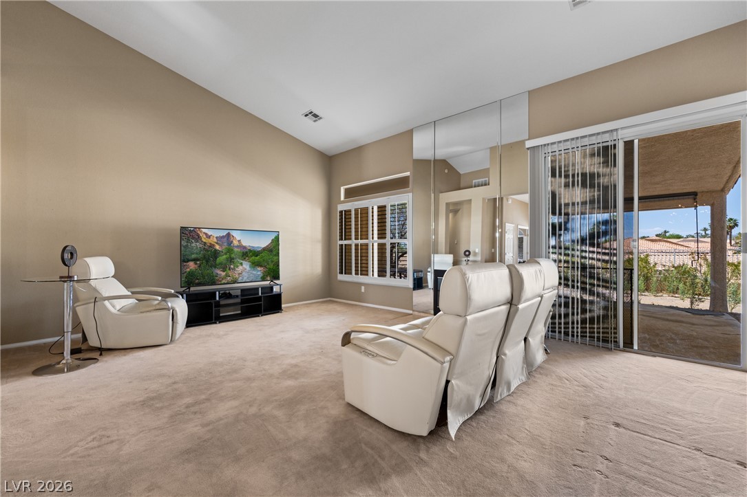 649 Rancho Circle Mesquite, NV 89027 - Photo 7 of 73 This expansive room offers a bright, open space with direct outdoor access and elegant vaulted ceilings.