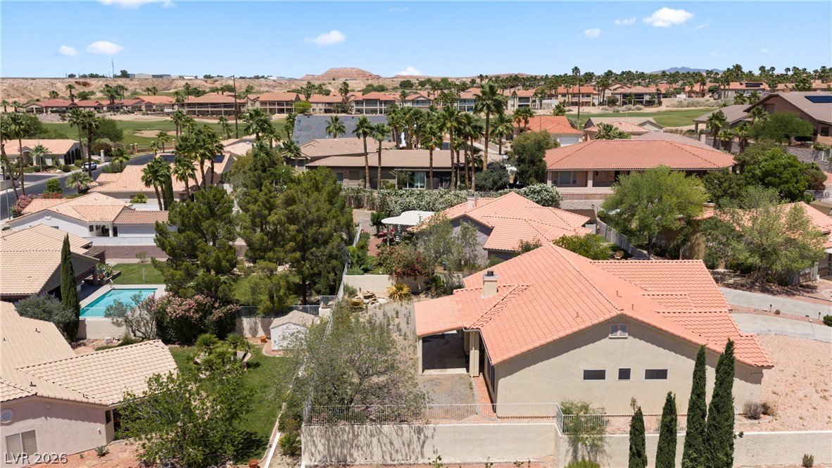 649 Rancho Circle Mesquite, NV 89027 - Photo 71 of 73 An aerial view captures the neighborhood with lush trees and a sparkling swimming pool.