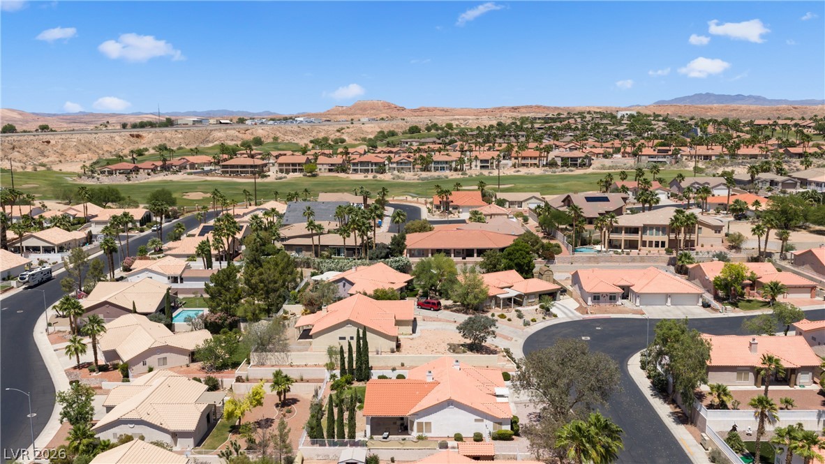 649 Rancho Circle Mesquite, NV 89027 - Photo 72 of 73 An aerial perspective reveals a vibrant neighborhood with desert landscaping and accessible roads.