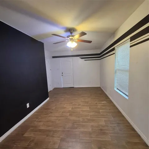 a bathroom with a toilet a sink and shower