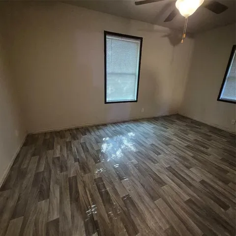 a bathroom with a toilet and a bathtub