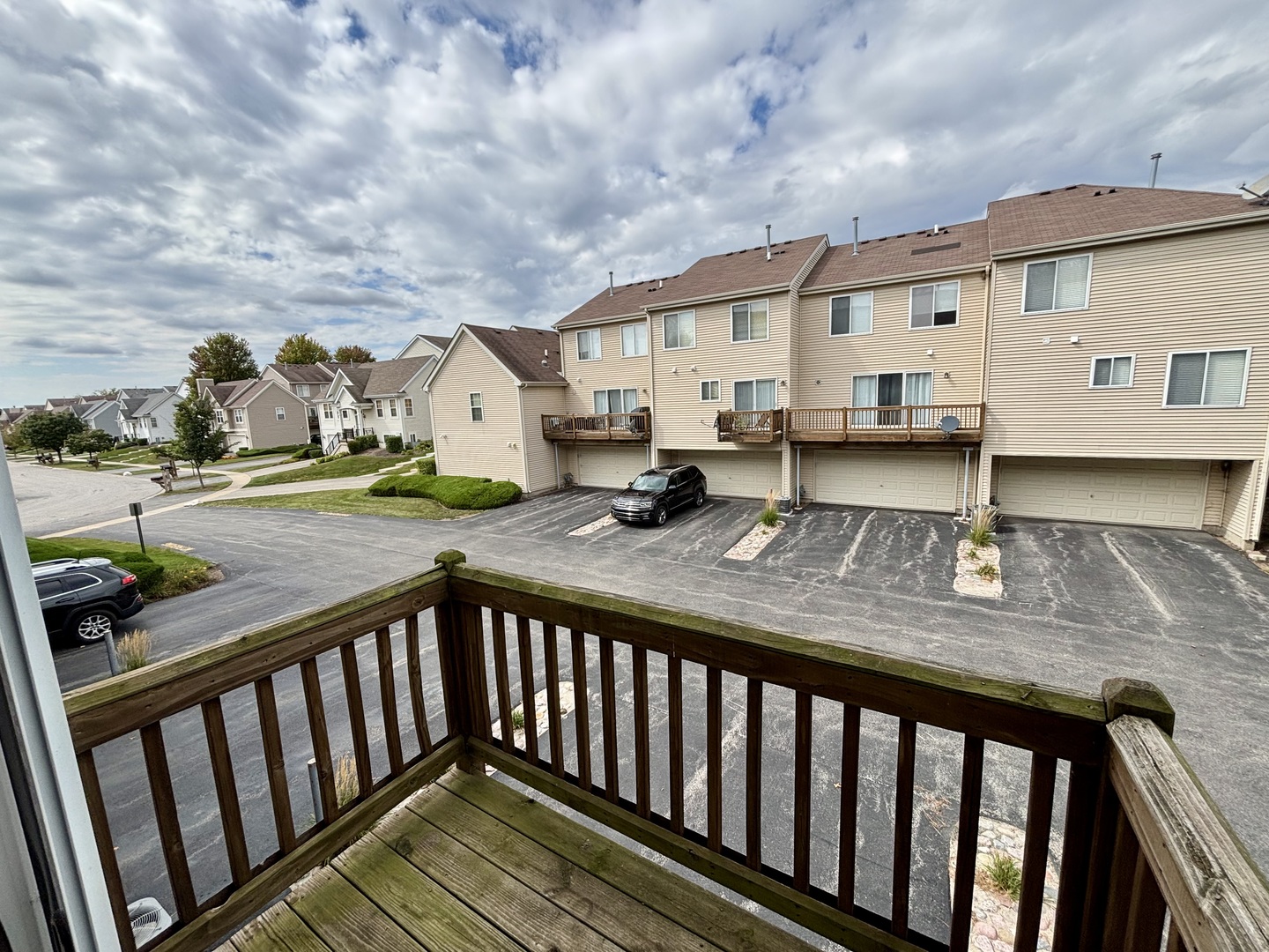 906 Clover Lane, Unit 906 Pingree Grove, IL 60140 - Photo 11 of 37 a view of house with wooden deck and furniture