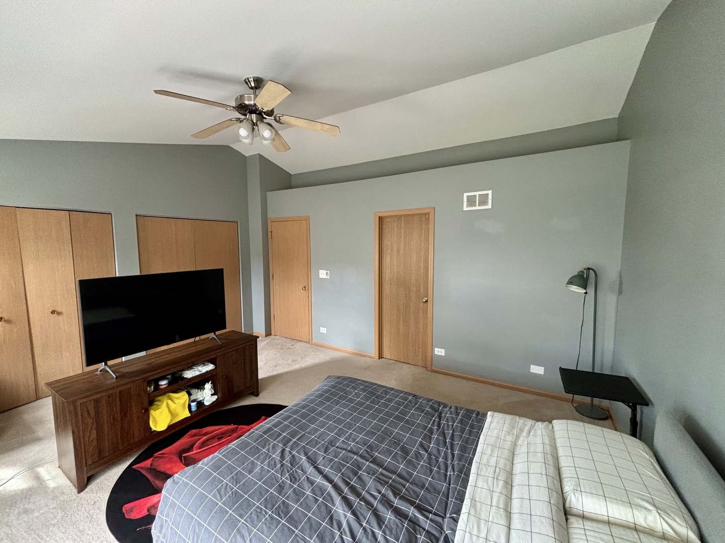 906 Clover Lane, Unit 906 Pingree Grove, IL 60140 - Photo 15 of 37 a bedroom with a bed and a flat screen tv