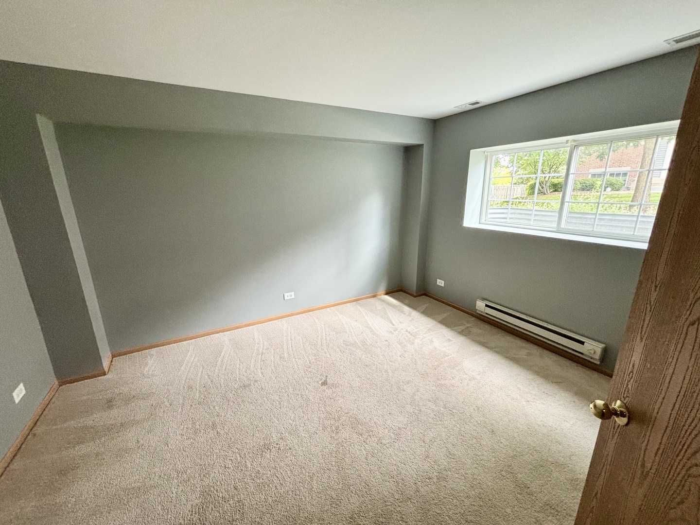 906 Clover Lane, Unit 906 Pingree Grove, IL 60140 - Photo 28 of 37 an empty room with windows