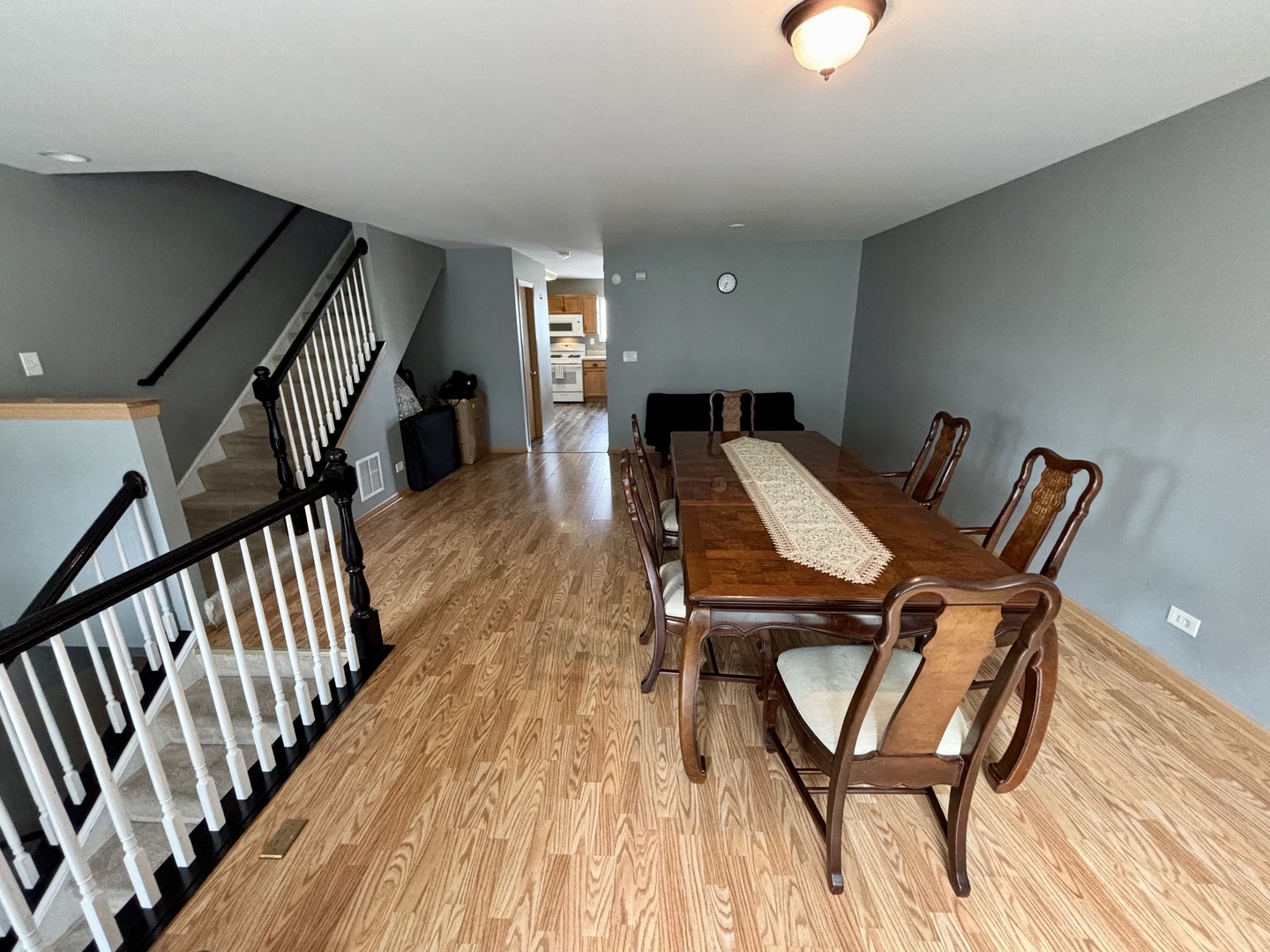 906 Clover Lane, Unit 906 Pingree Grove, IL 60140 - Photo 3 of 37 a view of a dining room with furniture and wooden floor
