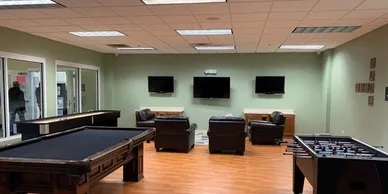 906 Clover Lane, Unit 906 Pingree Grove, IL 60140 - Photo 34 of 37 a kitchen with stainless steel appliances kitchen island granite countertop a stove and a microwave