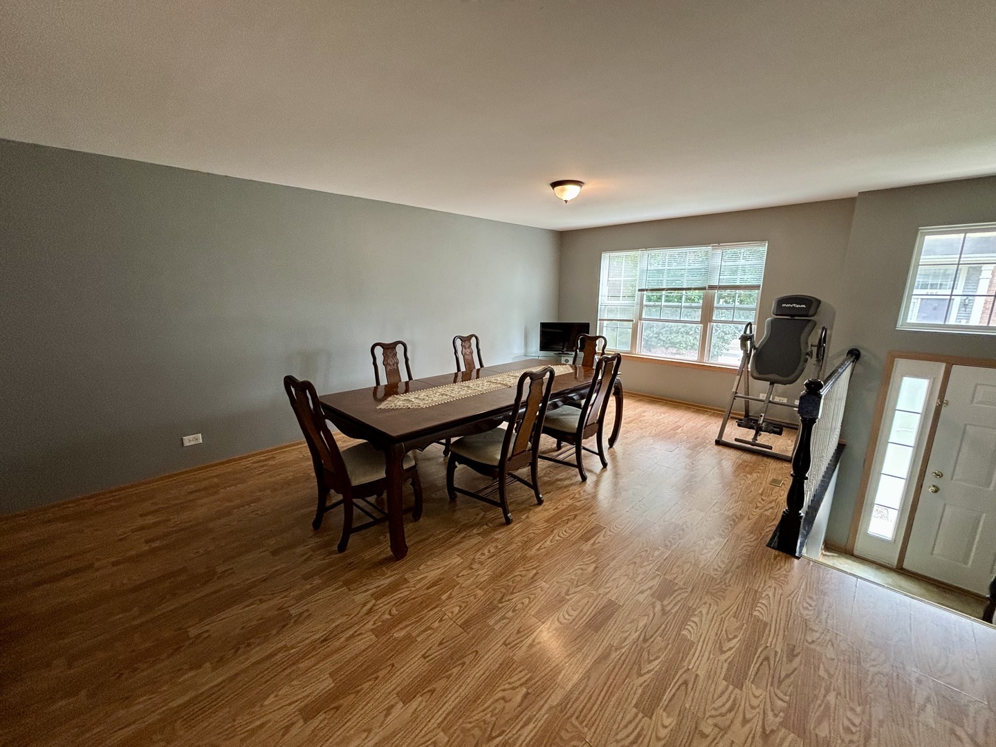 906 Clover Lane, Unit 906 Pingree Grove, IL 60140 - Photo 4 of 37 a view of a dining room with furniture window and wooden floor