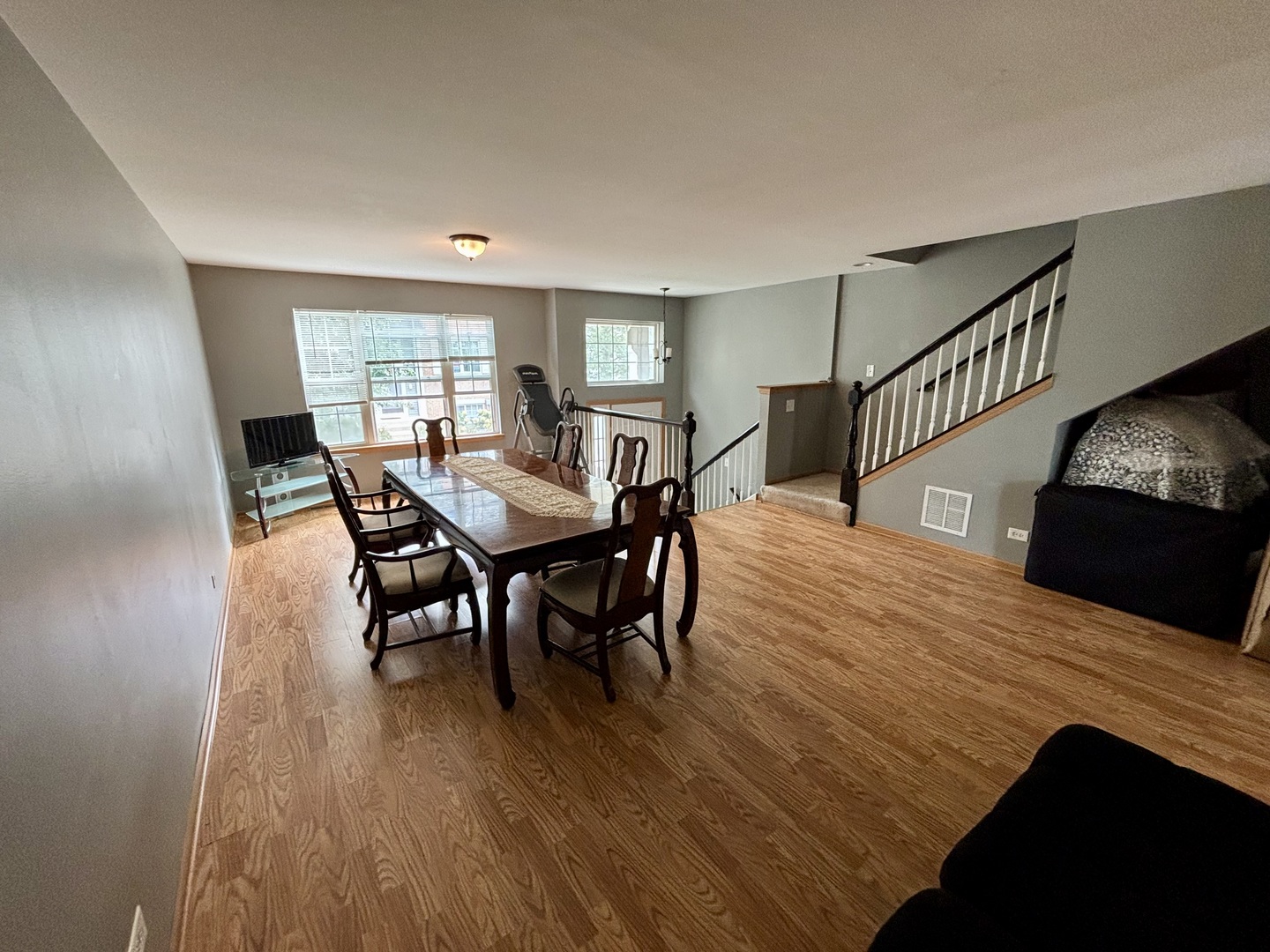 906 Clover Lane, Unit 906 Pingree Grove, IL 60140 - Photo 5 of 37 a view of a dining room with furniture and wooden floor