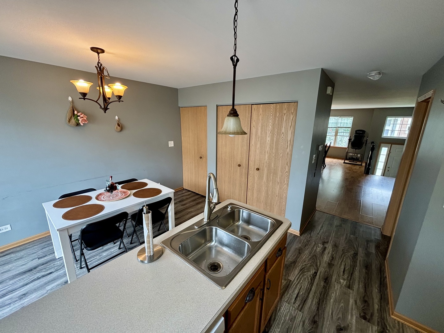 906 Clover Lane, Unit 906 Pingree Grove, IL 60140 - Photo 9 of 37 a room with furniture and chandelier