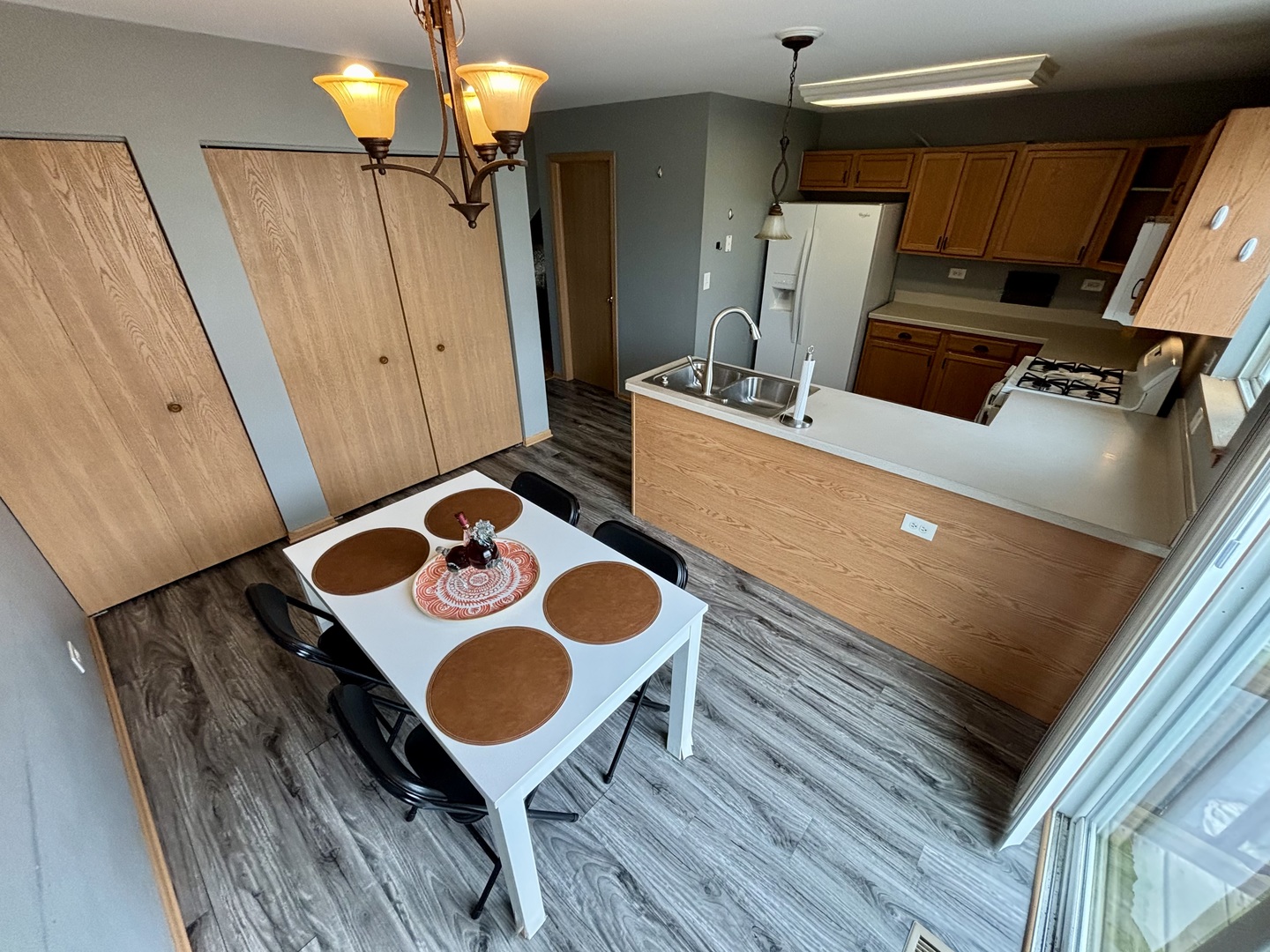 906 Clover Lane, Unit 906 Pingree Grove, IL 60140 - Photo 10 of 37 a living room with furniture and a table