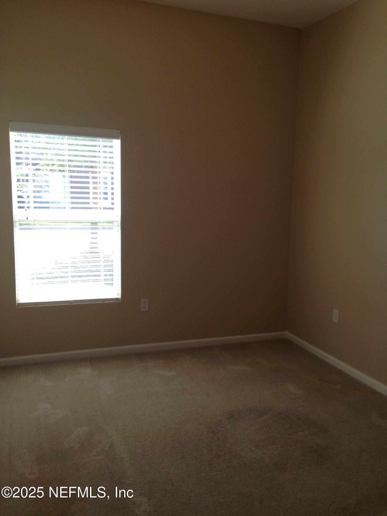 9625 Amarante Way, Unit 6 Jacksonville, FL 32257 - Photo 16 of 17 a view of an empty room with a window