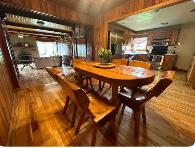 a view of a dining room with furniture and window