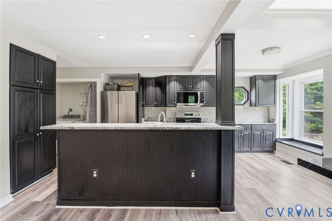 9110 Gayton Road Henrico, VA 23229 - Photo 7 of 54 a kitchen with stainless steel appliances a refrigerator and a sink