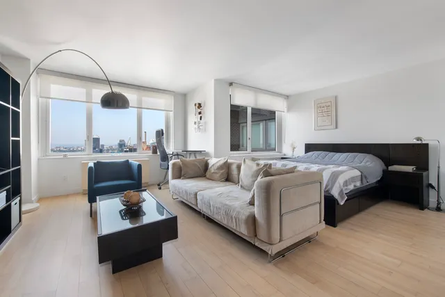 a kitchen with sink cabinets and dining table