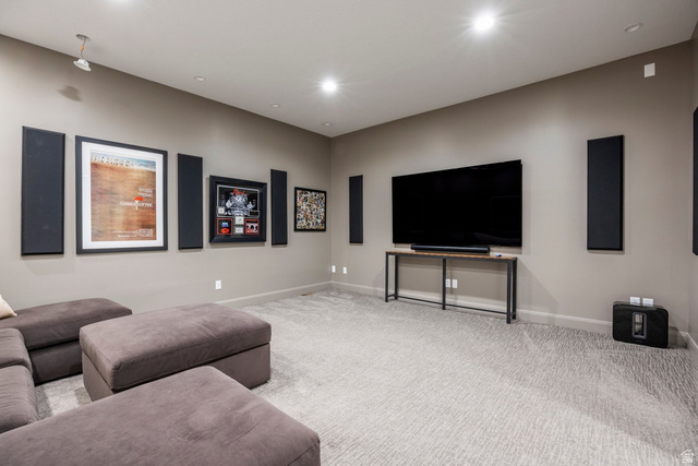 140 West Vista Road Kamas, UT 84036 - Photo 61 of 101 Recessed ceiling lighting, wall-mounted sound panels, light-colored patterned carpeting, and a console table with a wood-finish top
