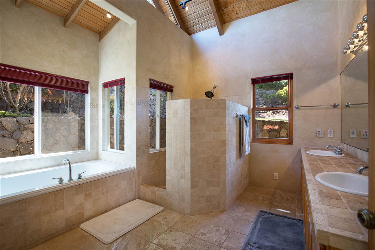 2623 Lower Kula Road Kula, HI 96790 - Photo 15 of 29 a bathroom with a tub shower and a sink