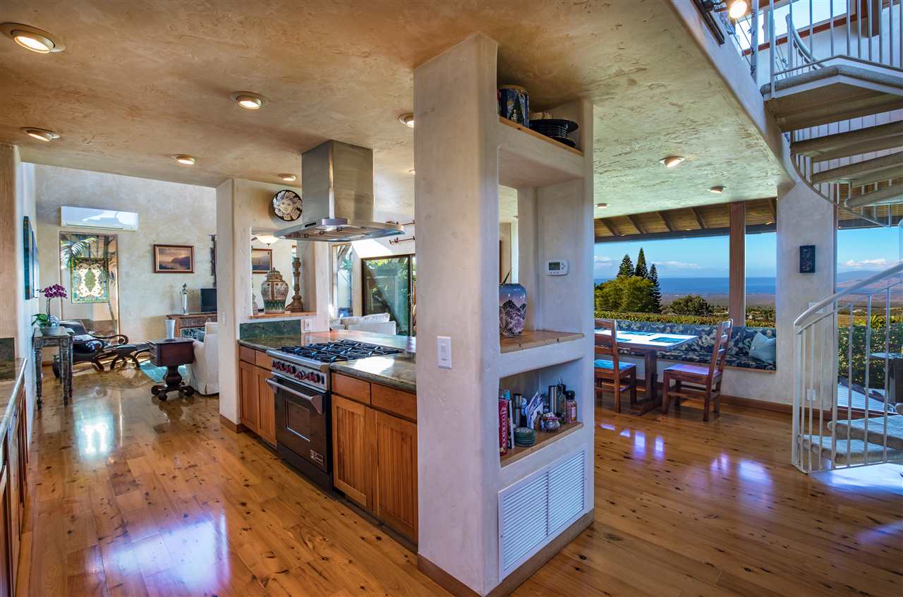 2623 Lower Kula Road Kula, HI 96790 - Photo 5 of 29 a kitchen with stainless steel appliances granite countertop a stove and a refrigerator