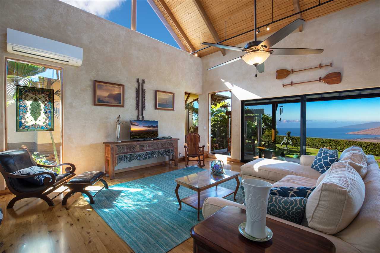 2623 Lower Kula Road Kula, HI 96790 - Photo 6 of 29 a living room with furniture and a large window