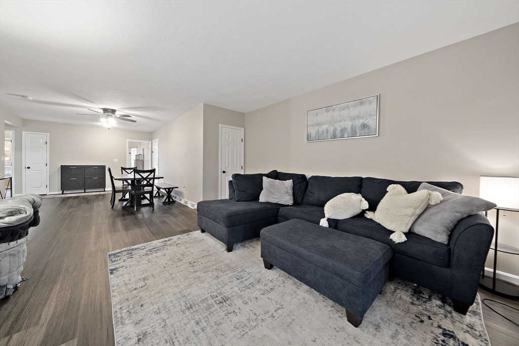 22 Union Square, Unit 22 Randolph, MA 02368 - Photo 1 of 28 a living room with furniture and wooden floor