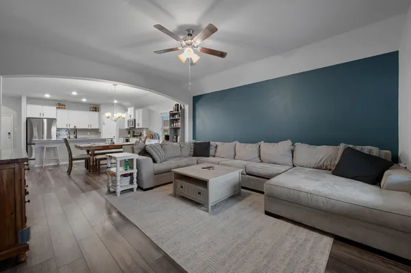 a view of a dining room with furniture and wooden floor