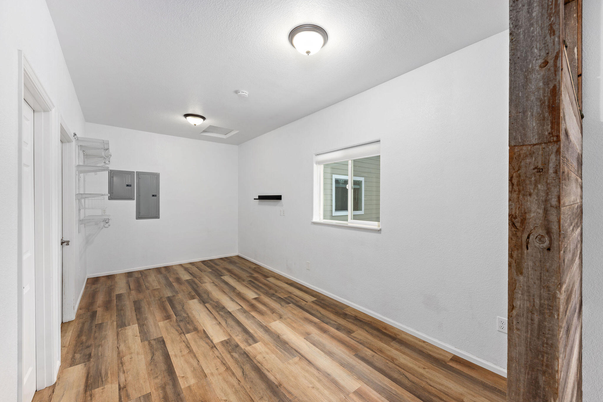 10523 Lower River Road Grants Pass, OR 97526 - Photo 35 of 58 Room for a bed and bedroom setup in this space in the apartment.