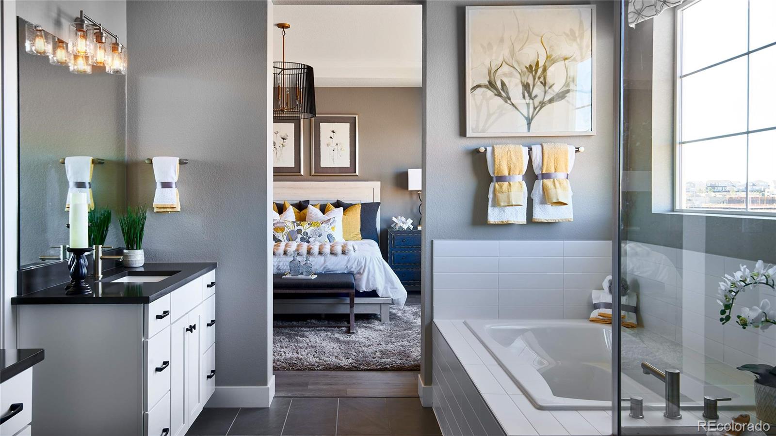 3867 Freestone Point Castle Rock, CO 80108 - Photo 16 of 38 a bathroom with a tub sink and mirror