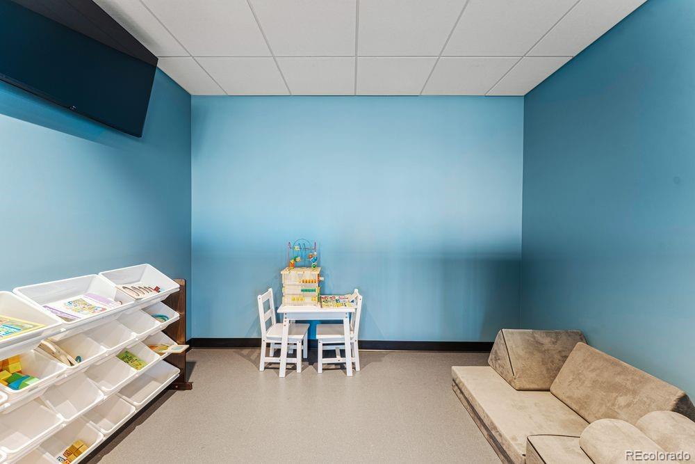3867 Freestone Point Castle Rock, CO 80108 - Photo 28 of 38 a bedroom with a bed and a chair
