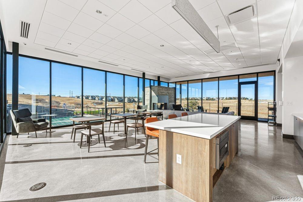 3867 Freestone Point Castle Rock, CO 80108 - Photo 31 of 38 a kitchen with a large window and a counter space