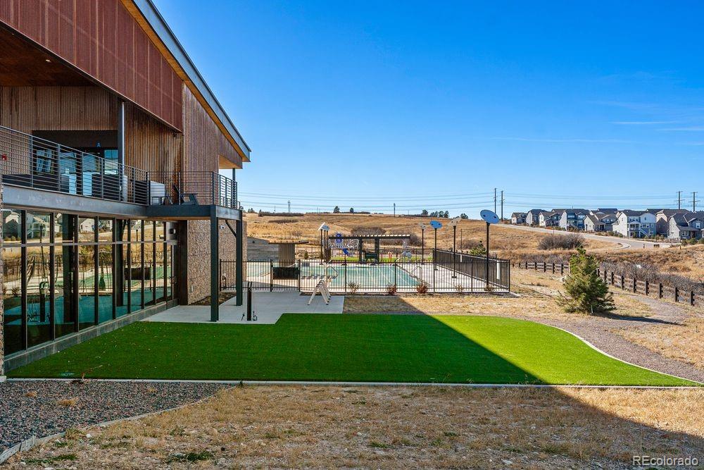 3867 Freestone Point Castle Rock, CO 80108 - Photo 34 of 38 a view of a patio with a table and chairs