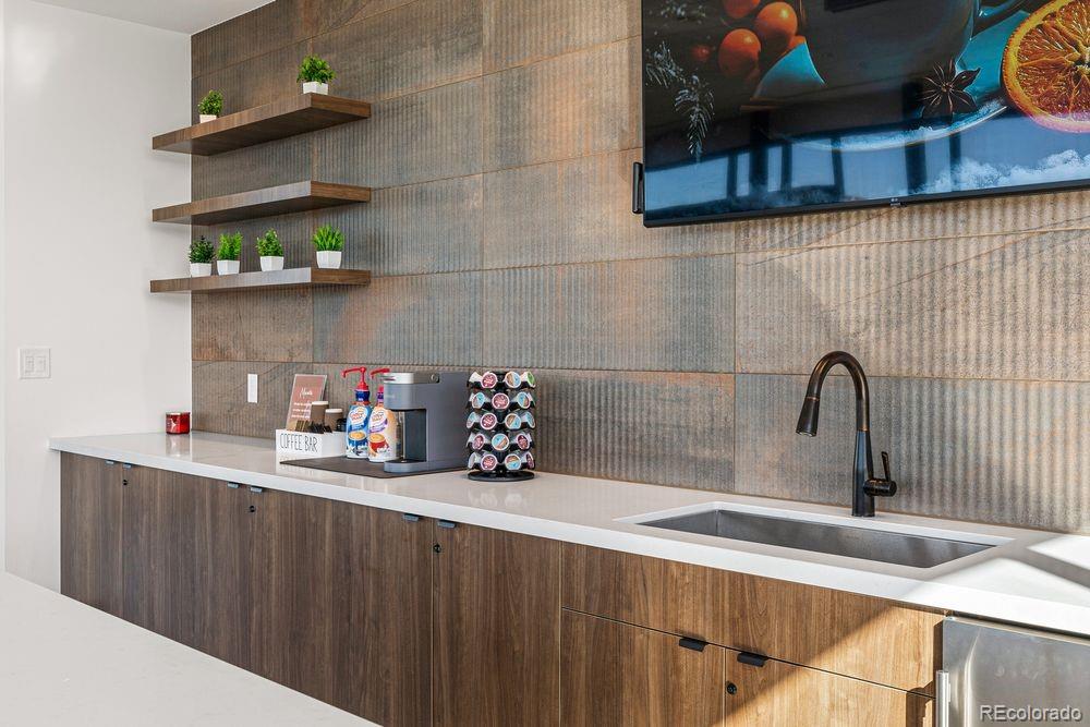 3867 Freestone Point Castle Rock, CO 80108 - Photo 37 of 38 a kitchen with a sink and cabinets