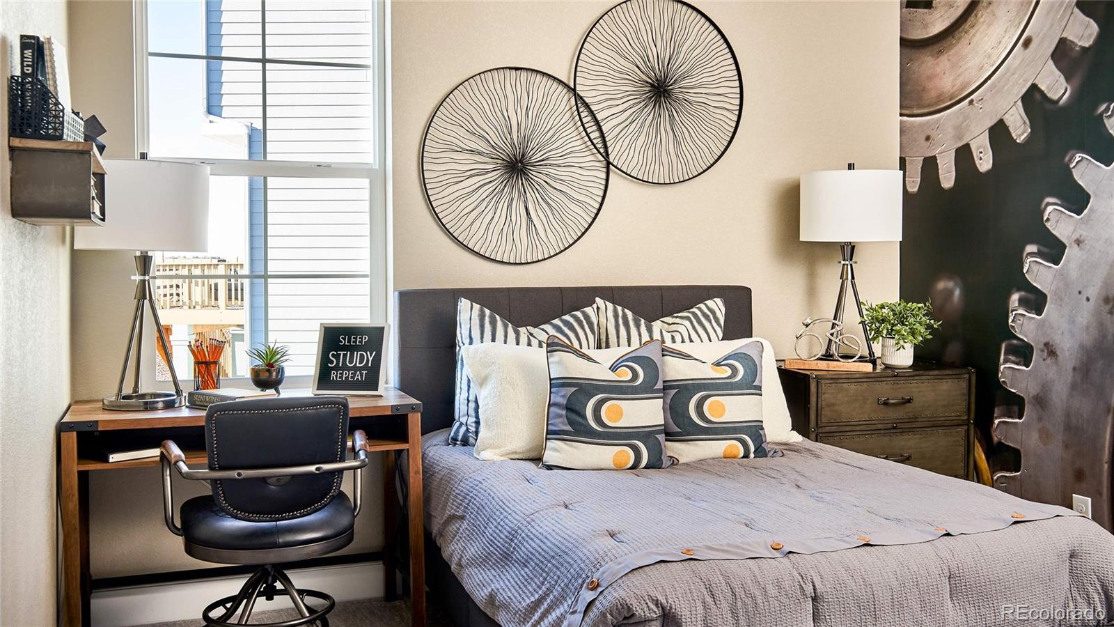 3867 Freestone Point Castle Rock, CO 80108 - Photo 6 of 38 a bedroom with a bed and a chair in it