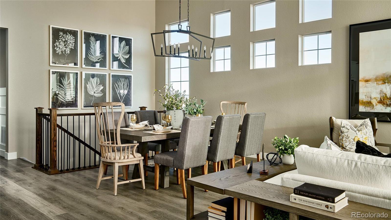 3867 Freestone Point Castle Rock, CO 80108 - Photo 8 of 38 a view of a dining room with furniture window and wooden floor