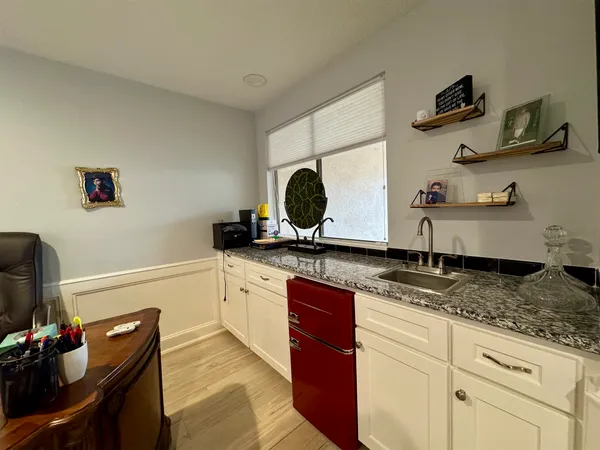 a view of an entryway with a table and chairs