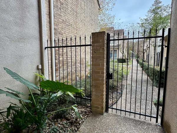 a living room with furniture chandelier and a table