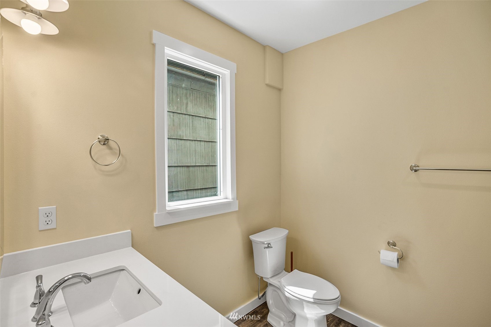 3113 Oakes Avenue Everett, WA 98201 - Photo 14 of 38 a white toilet sitting next to a bathroom sink