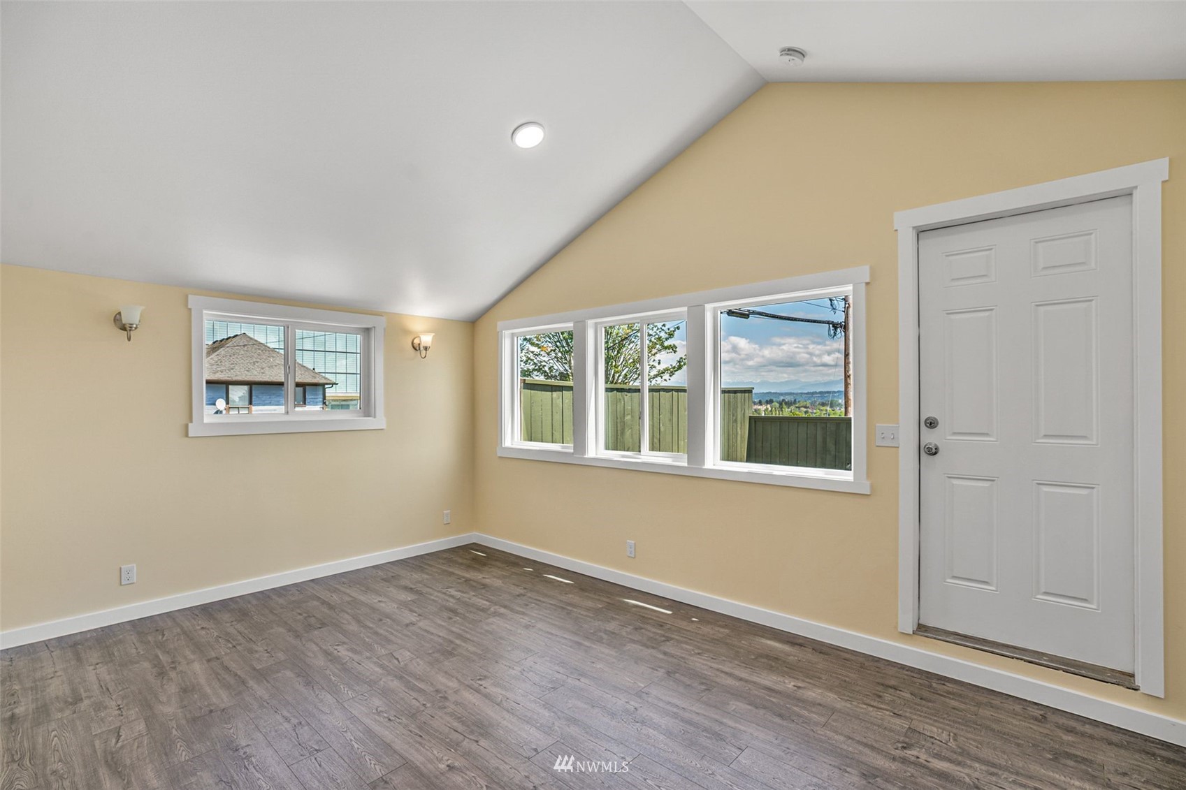 3113 Oakes Avenue Everett, WA 98201 - Photo 19 of 38 an empty room with wooden floor and windows