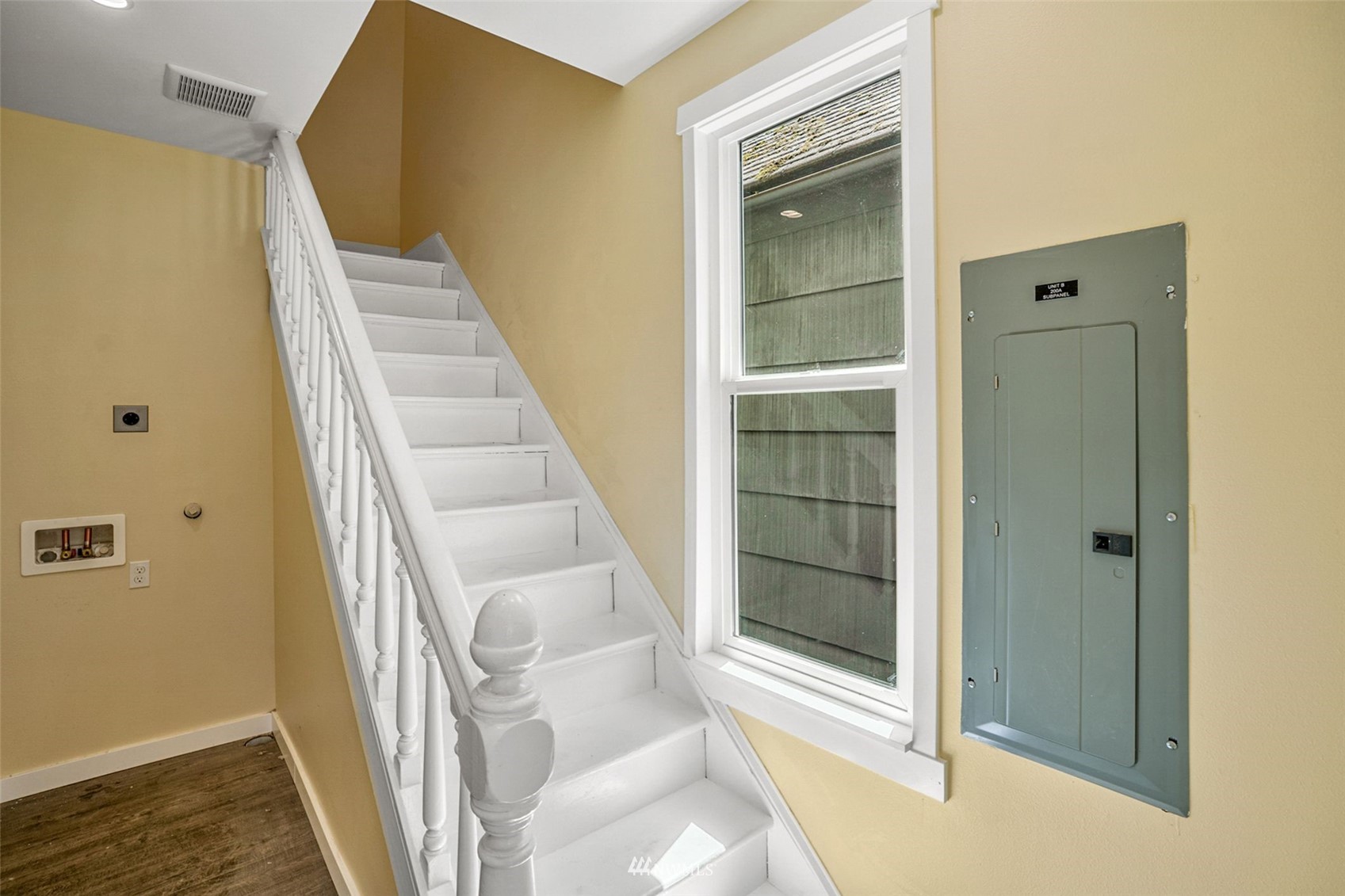 3113 Oakes Avenue Everett, WA 98201 - Photo 25 of 38 a view of staircase with white walls and door