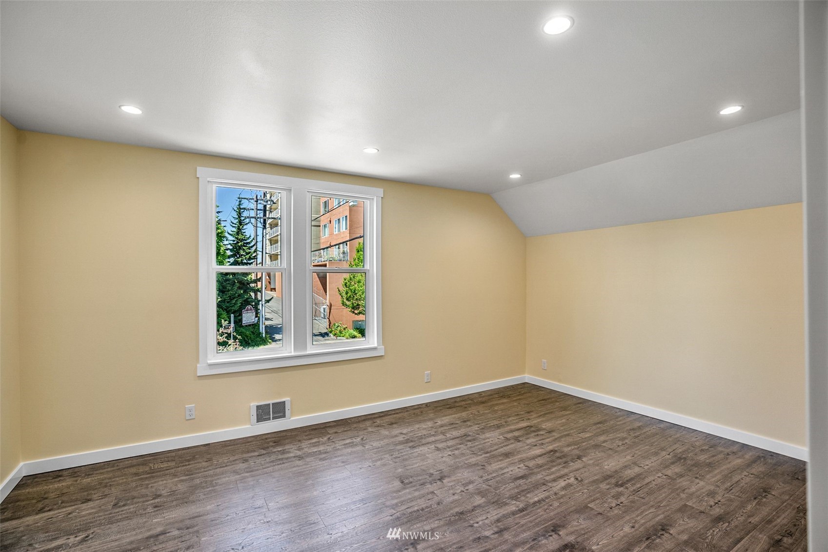 3113 Oakes Avenue Everett, WA 98201 - Photo 26 of 38 an empty room with wooden floor and windows