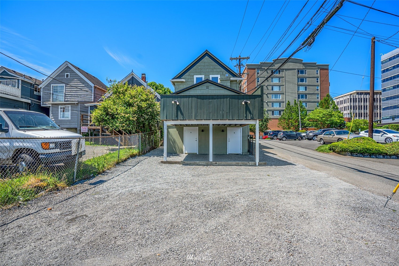3113 Oakes Avenue Everett, WA 98201 - Photo 36 of 38 a front view of a house with a yard and garage